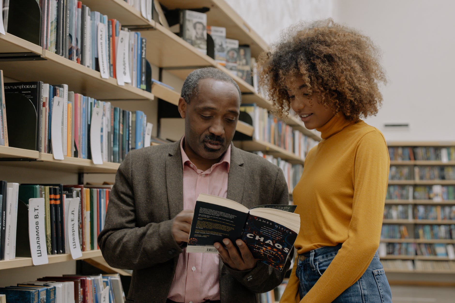 Father with growth mindset explaining a story in a novel to his daughter