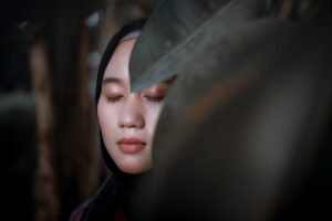 Woman eyes closed. No vision in academics is similar to walking with eyes closed