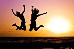 Two young ladies successful after undergoing through a positive mindset change