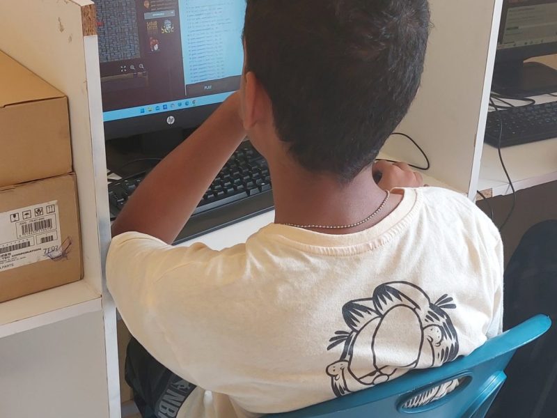 A teenager learning coding for beginners in computer lab A teenager learning coding for beginners in computer laboratory